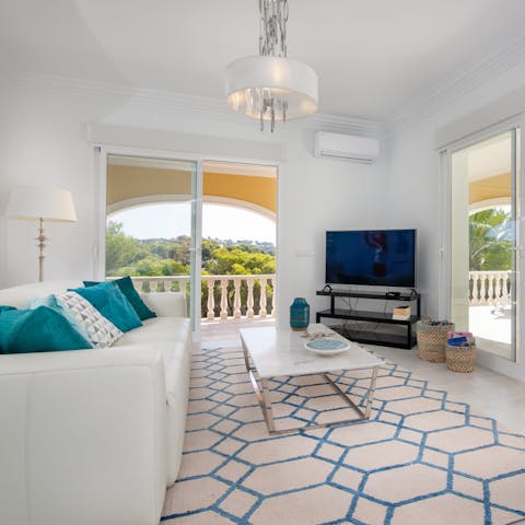 Retreat inside when you need a break from the sun and lounge in the breezy living area