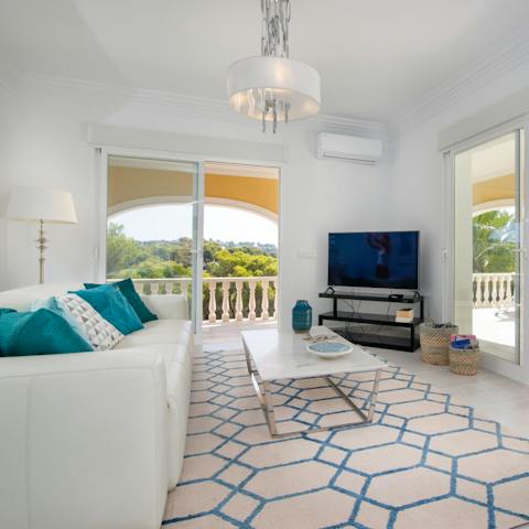 Retreat inside when you need a break from the sun and lounge in the breezy living area