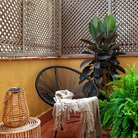 Savour a glass of wine as the night rolls in on the private balcony