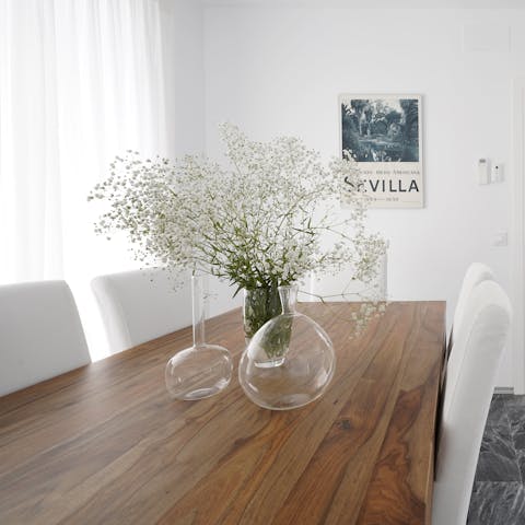 Serve up some delicious tapas dishes and Spanish wine at the chic dining table