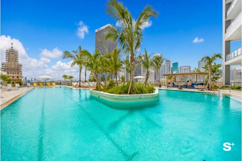 Make a splash in the communal pool on a sunny afternoon