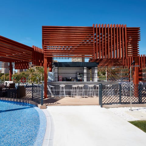 Visit the on-site poolside bar and enjoy a cocktail while taking in the views