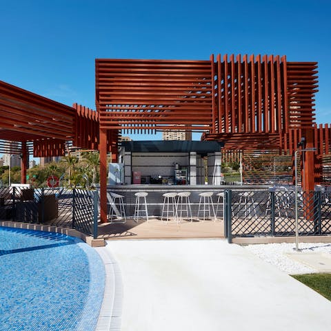 Visit the on-site poolside bar and enjoy a cocktail while taking in the views