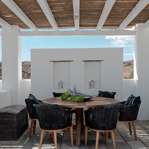 Tuck into some traditional Greek food under the pergola