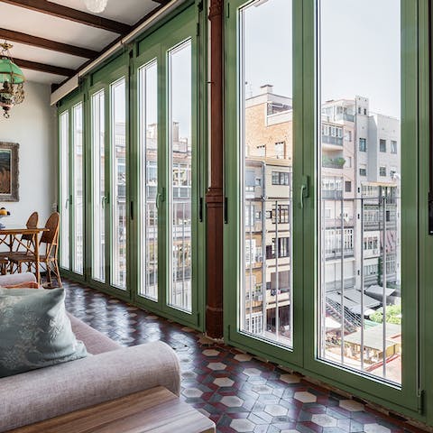 Throw open the French doors and let in a cooling breeze to the sunroom