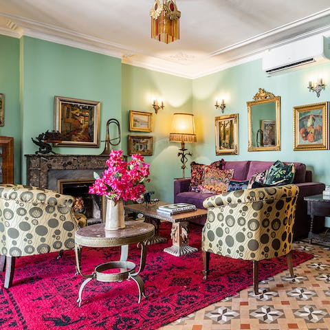 Gather guests together for cocktails in the eclectically decorated living room