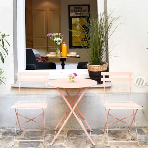 Spend evenings relaxing in the pretty courtyard
