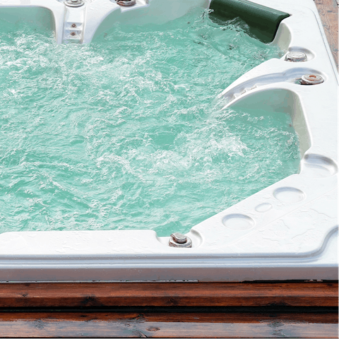 Enjoy a relaxing soak in your private outdoor hot tub