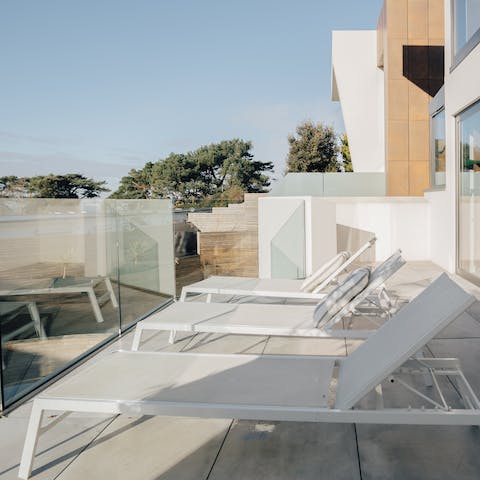 Enjoy a spot of sunbathing on the first-floor balcony