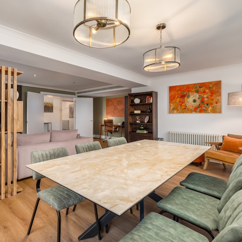 Dine together in the chic living and dining space