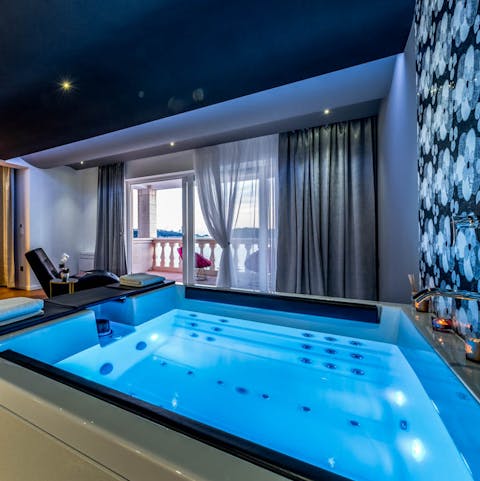 Luxuriate in the main bedroom's private jacuzzi hot tub