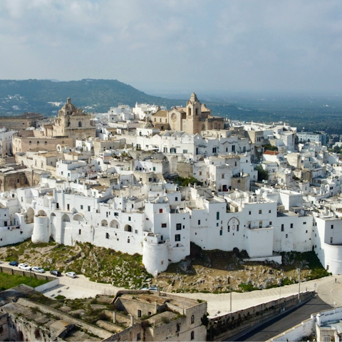 Discover Ostuni's whitewashed old town, less than half an hour's drive