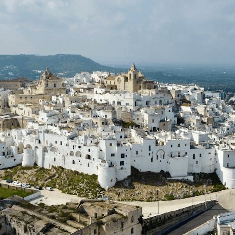 Discover Ostuni's whitewashed old town, less than half an hour's drive