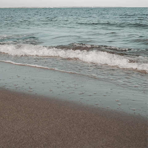 Take a seven-minute drive to Itilo Beach to spend the day sunbathing