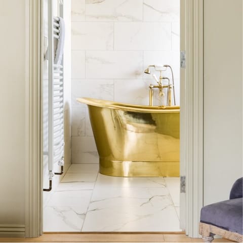 Bathe like royalty in the luxury brass bath