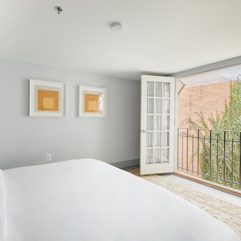 Throw open the French doors upon waking up and breathe in the fresh air