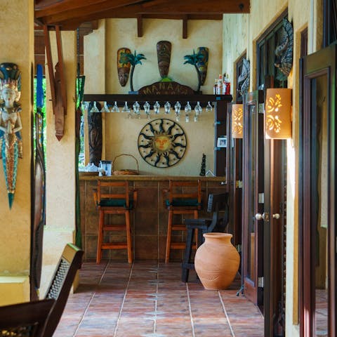 Sip cocktails prepared at the full service bar