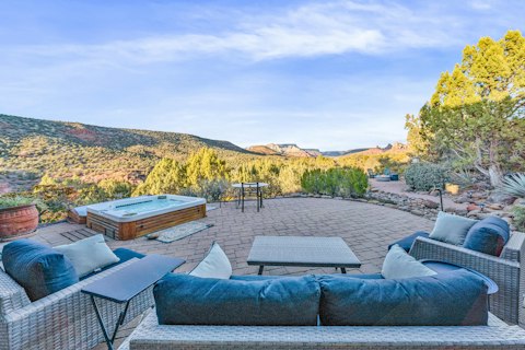 Ease into the hot tub as red rock formations glow at dusk
