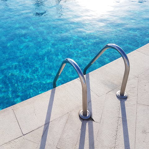 Go for a swim in the pool or sunbathe on the sun loungers