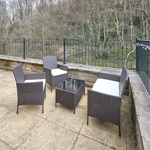 Sip your morning coffee on the terrace surrounded by greenery
