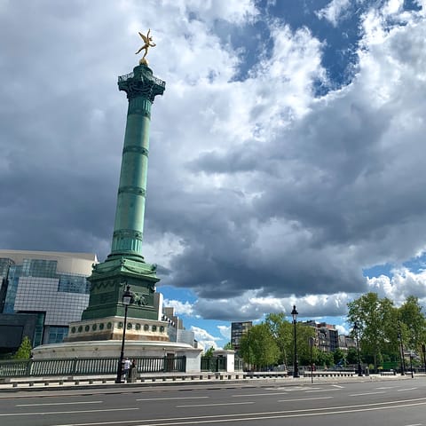 Stroll down to the Place de la Bastille to see the famous July Column monument
