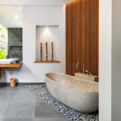 Enjoy a relaxing soak in the stone bathtub
