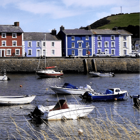 Admire the pretty houses and boats in Aberaeron harbour