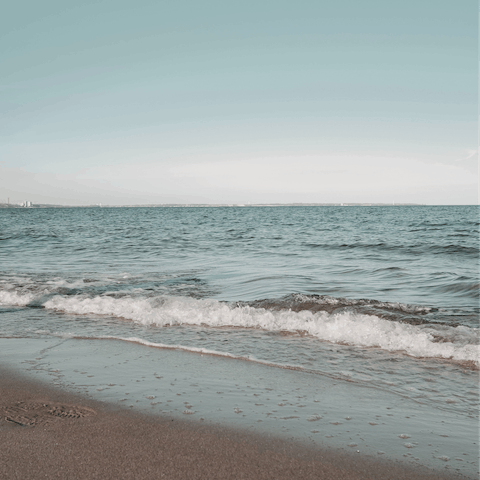 Swim in the clear blue sea of Kastraki beach, a short drive away