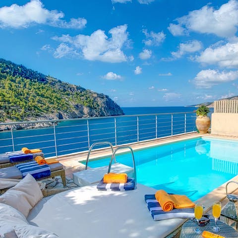 Savour beautiful sea views whilst relaxing by the pool