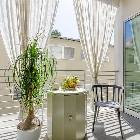 Enjoy a calm start to your morning with coffee on the private balcony