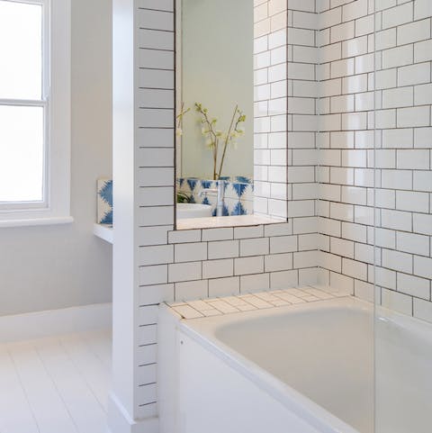 The metro-style tiled bathroom