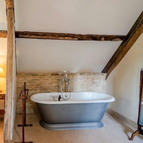 Soak in the roll top bath under beautiful old beams
