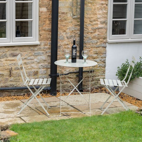 Enjoy an evening tipple to the sound of birdsong in the private garden