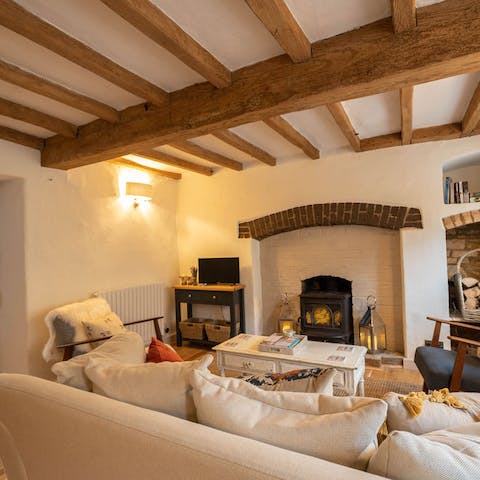 Embrace cottage-core vibes in the wood-beamed living room