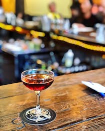 Savour handcrafted cocktails and inventive bar food at The Alembic