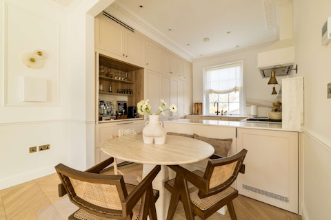 Brew espresso at the marble-topped kitchen island, where mornings begin in style