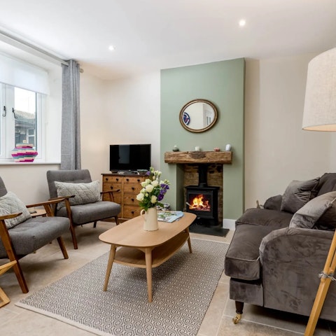 Cosy up by the wood burner after a day exploring the Cotswolds