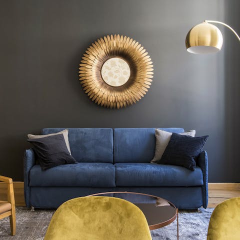 Sink into the inviting blue velvet sofa after a day of exploring Rome's historic centre