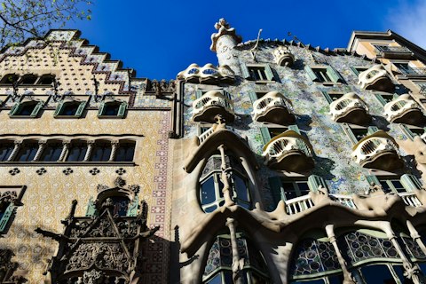 Marvel at Gaudí's Casa Batlló with its dragon-scale façade, a ten-minute walk