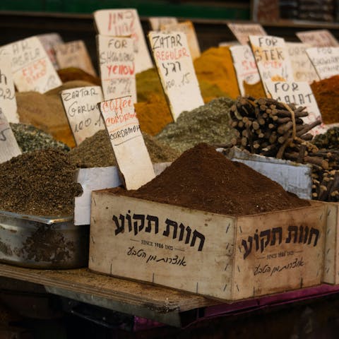 Shop for spices at Carmel Market, it's less than thirty minutes on foot