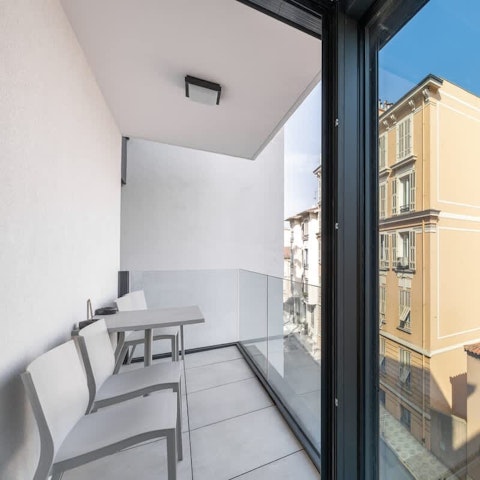 Bask in a gentle breeze on the private balcony