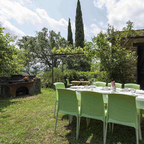 Dine in the garden, with its wood-fired oven and barbecue