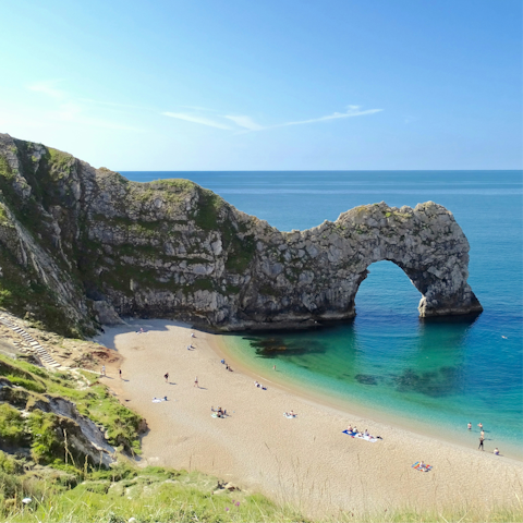 Explore hidden coves along the Jurassic Coast — Durdle Door is just a short drive away