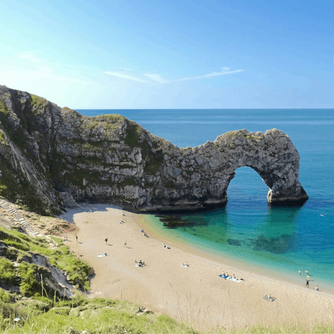 Explore hidden coves along the Jurassic Coast — Durdle Door is just a short drive away