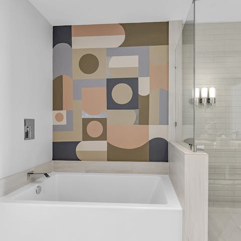 Freshen up in the huge shower or the luxurious soaking tub