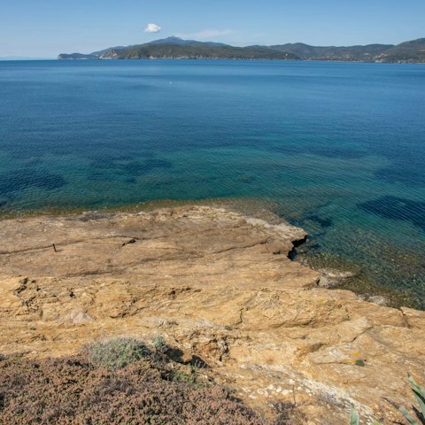 Walk down the path to the private beach for a dip in the sea