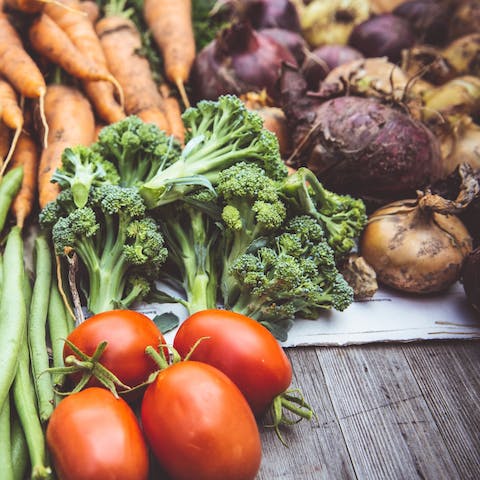 Pick fresh produce from the owner's vegetable garden and chicken coop