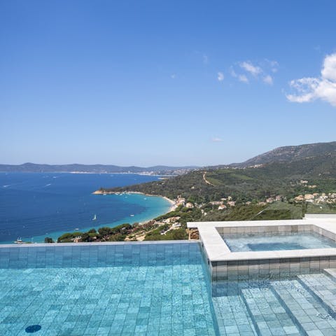 Unwind in the pool and jacuzzi with views across the sea