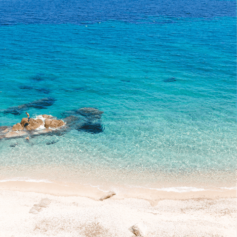 Sunbathe on the tranquility of the beach, just a nineteen minute walk away
