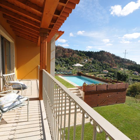 Admire the view, and that pool, from the home's inviting balconies